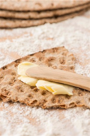 sweden - Rye crispbread from Sweden with butter and a wooden knife Stock Photo - Premium Royalty-Free, Code: 659-07068805