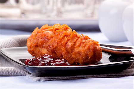 empanado - Chicken breast with a cornflake crust Foto de stock - Sin royalties Premium, Código: 659-07068935