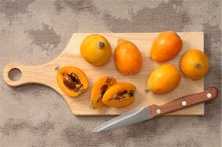 simsearch:659-07027554,k - Medlars, whole and halved, on a chopping board Stock Photo - Premium Royalty-Free, Code: 659-07068966