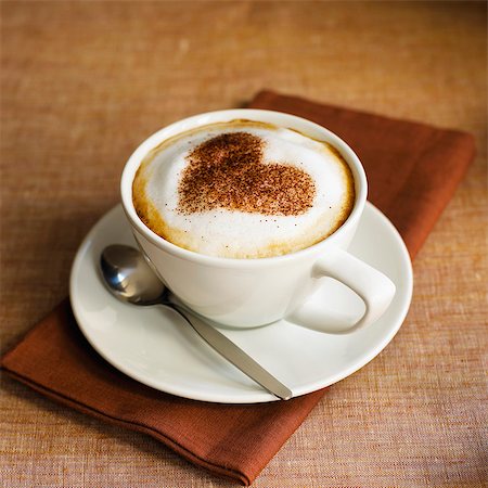 Cappuccino topped with cocoa in the shape of a heart Stock Photo - Premium Royalty-Free, Code: 659-07069018