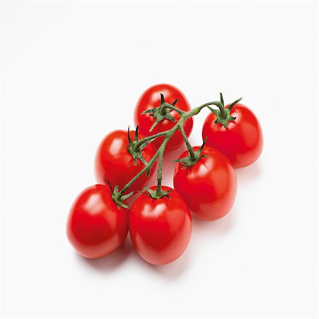 Plum tomatoes on the vine Foto de stock - Sin royalties Premium, Código: 659-07069037