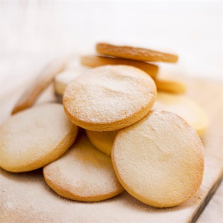 dredging sugar - Sugared shortbread biscuits Stock Photo - Premium Royalty-Free, Code: 659-07069033