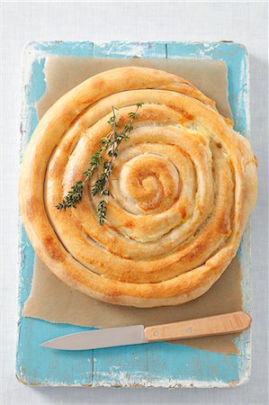 pastry aerial - Burek (flatbread filled with cheese, Bosnia and Herzegovina) Stock Photo - Premium Royalty-Free, Code: 659-07069068