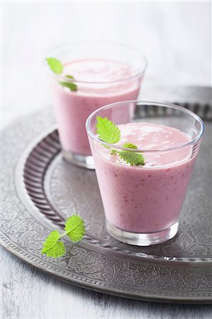 simsearch:659-06186104,k - Two raspberry milkshakes with lemon balm Stock Photo - Premium Royalty-Free, Code: 659-07069256