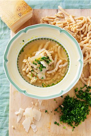 soup top view - Pasta soup with passatelli pasta, parmesan and parsley (Italy) Stock Photo - Premium Royalty-Free, Code: 659-07069401