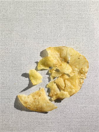 A crushed potato chip (view from above) Stock Photo - Premium Royalty-Free, Code: 659-07069442
