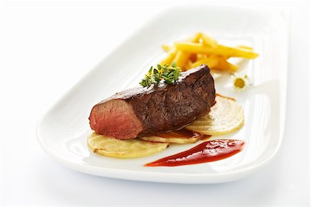 Saddle of venison with fried sugar beet, potato pasta and cornelian cherry coulis Stock Photo - Premium Royalty-Free, Code: 659-07069570