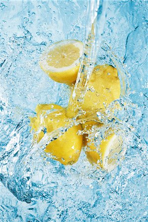 pouring water stream - Water being poured over lemons Stock Photo - Premium Royalty-Free, Code: 659-07069659