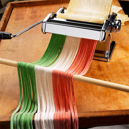 raw pasta photography - Pasta Maker with Homemade Green, White and Red Noodles Stock Photo - Premium Royalty-Free, Code: 659-07597014