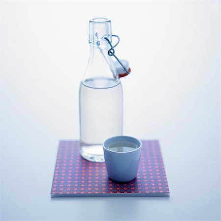 simsearch:659-06152269,k - A stoppered bottle and a cup of water Stock Photo - Premium Royalty-Free, Code: 659-07597054