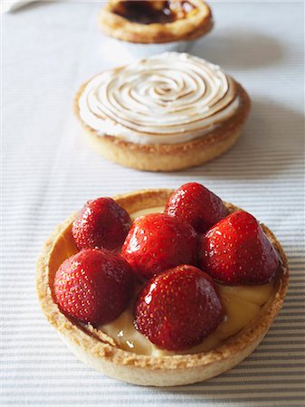 strawberry tartlet - Three custard tarts Stock Photo - Premium Royalty-Free, Code: 659-07597163