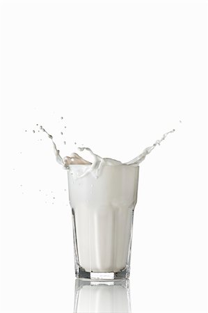 simsearch:659-06902475,k - Milk splashing out of glass Stock Photo - Premium Royalty-Free, Code: 659-07597256