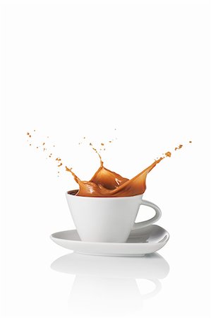 splash coffee - A latte splashing out of the cup Stock Photo - Premium Royalty-Free, Code: 659-07597257