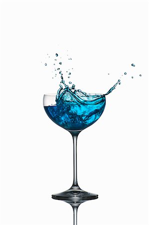 squirting - Blue Curaçao splashing out of the glass Stock Photo - Premium Royalty-Free, Code: 659-07597251