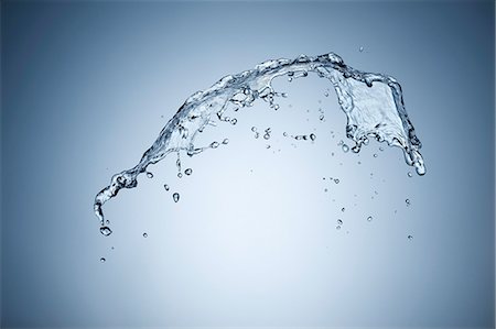 plain (simple) - A splash of water against a grey background Stock Photo - Premium Royalty-Free, Code: 659-07597427