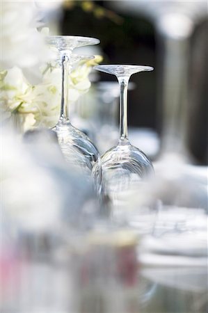 simsearch:659-08904121,k - Upturned wine glasses on a table laid for a meal Stock Photo - Premium Royalty-Free, Code: 659-07597460