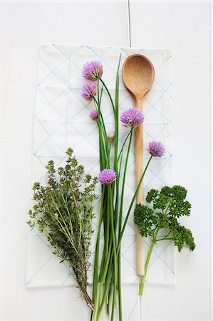 Fresh garden herbs with a wooden spoon Stock Photo - Premium Royalty-Free, Code: 659-07597593