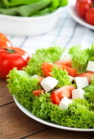 Frisée lettuce with tomatoes and mozzarella Stock Photo - Premium Royalty-Free, Code: 659-07597657