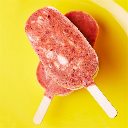 Two home-made ice lollies with cherry ice cream, on a plate Stock Photo - Premium Royalty-Free, Code: 659-07597715