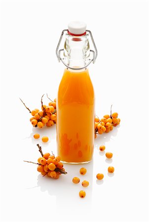 Sea buckthorn juice in a stoppered bottle Stock Photo - Premium Royalty-Free, Code: 659-07597745