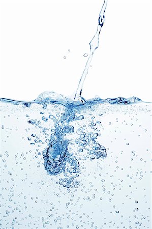 simsearch:659-03535938,k - A jet of water shooting into a basin of water Fotografie stock - Premium Royalty-Free, Codice: 659-07597785