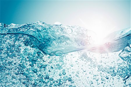 splashing into water - Moving water surface with air bubbles Stock Photo - Premium Royalty-Free, Code: 659-07597786