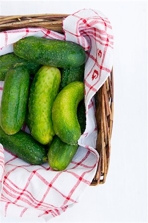 pickling cucumber - Pickling cucumbers with a cloth in a basket Stock Photo - Premium Royalty-Free, Code: 659-07598056