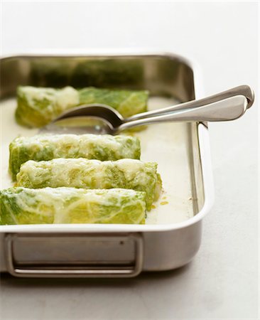 stuffed vegetable - Rolled savoy cabbage leaves with a cheese sauce Foto de stock - Sin royalties Premium, Código: 659-07598195