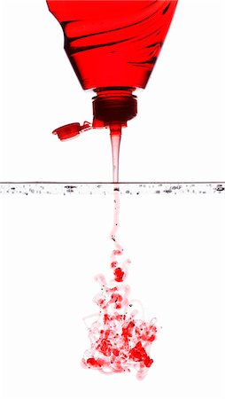 running water bottle - Red washing-up liquid running into water Stock Photo - Premium Royalty-Free, Code: 659-07598236