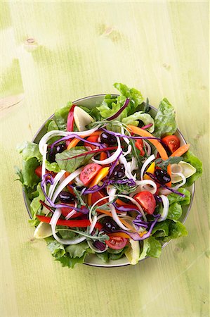 salad overhead - Mixed salad leaves with sliced vegetables, tomatoes and olives Stock Photo - Premium Royalty-Free, Code: 659-07598282