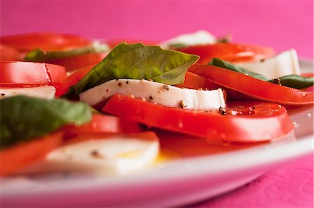 Insalata caprese (tomato salad with mozzarella and basil) Stock Photo - Premium Royalty-Free, Code: 659-07598648