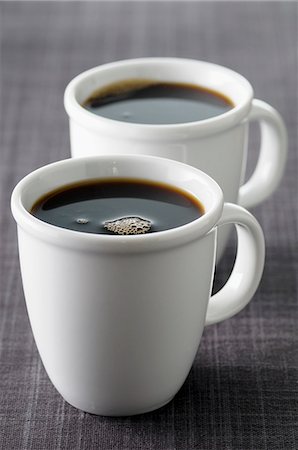 simsearch:659-07610074,k - Two cups of black coffee Foto de stock - Sin royalties Premium, Código: 659-07598741