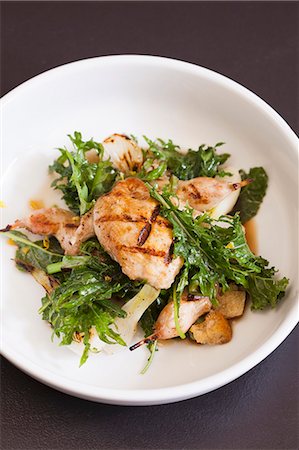 salad prepared plates - Grilled Quail with Wilted Baby Kale Salad and Onions Stock Photo - Premium Royalty-Free, Code: 659-07598750