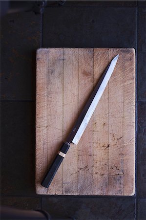 schneidebrett - A Knife on a Cutting Board Foto de stock - Sin royalties Premium, Código: 659-07598791