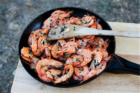 shrimp in frying pan dish - Fried king prawns with garlic and parsley Stock Photo - Premium Royalty-Free, Code: 659-07598843