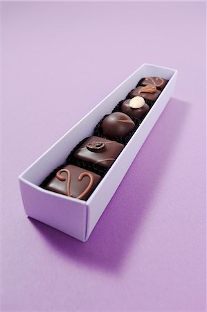 fuchsia - Assorted chocolates in a box Stock Photo - Premium Royalty-Free, Code: 659-07598909