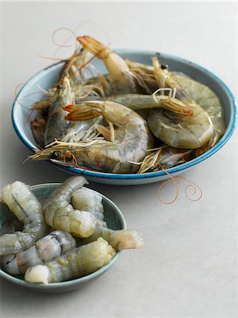 raw shrimps - Fresh king prawns, whole and peeled Stock Photo - Premium Royalty-Free, Code: 659-07598903