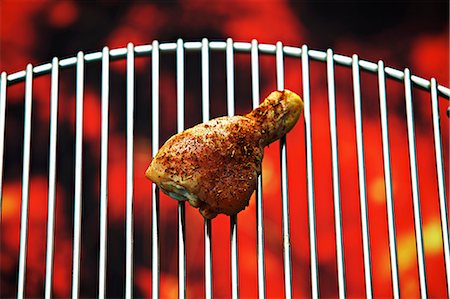 simsearch:659-03535955,k - A chicken drumstick on a barbecue Stock Photo - Premium Royalty-Free, Code: 659-07598936