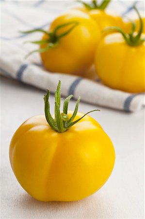 food on yellow - Yellow tomatoes (of the variety Golden Queen) Stock Photo - Premium Royalty-Free, Code: 659-07599007