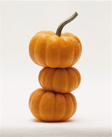 pumpkin - Three orange squash stacked one on top of the other Stock Photo - Premium Royalty-Free, Code: 659-07599068