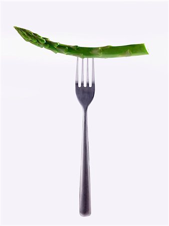 simsearch:659-06306452,k - A stem of green asparagus on a fork Stock Photo - Premium Royalty-Free, Code: 659-07599294