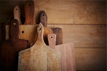 Still Life of assorted wooden cutting boards Stock Photo - Premium Royalty-Free, Code: 659-07609597