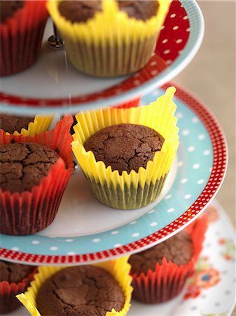 Gluten-free chocolate muffins on a tiered cake stand Stock Photo - Premium Royalty-Free, Code: 659-07609789