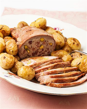 simsearch:659-06307688,k - Roasted stuffed beef with potatoes Stock Photo - Premium Royalty-Free, Code: 659-07609864