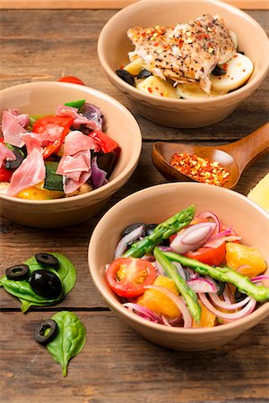 simsearch:659-09124173,k - Three different salads (asparagus salad, vegetable salad with Parma ham and potato salad with fish) Fotografie stock - Premium Royalty-Free, Codice: 659-07609868