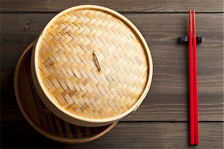 steaming basket - A bamboo steamer and chopsticks Stock Photo - Premium Royalty-Free, Code: 659-07610062