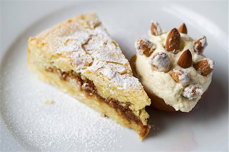 recipe - A slice of almond tart with almond ice cream Stock Photo - Premium Royalty-Free, Code: 659-07610259