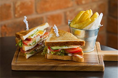 sandwich not people not outdoors - Club sandwiches with chips Stock Photo - Premium Royalty-Free, Code: 659-07610264