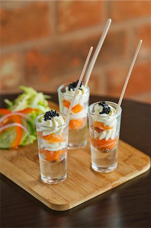 simsearch:659-06372914,k - Smoked salmon with cream and caviar served in shot glasses Foto de stock - Sin royalties Premium, Código: 659-07610291