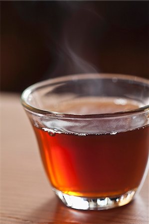 A glass cup of hot, steaming tea Stock Photo - Premium Royalty-Free, Code: 659-07738661